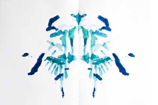 Rorschach test used in Psychoanalysis. Symmetric, mirror images made of granulated ink on white background