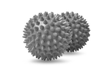 Two gray spiny massage balls isolated on white. Concept of physiotherapy or fitness. Closeup of a colorful rubber ball for dog teeth on a white color background. Corona virus model.