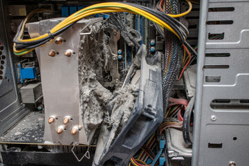 Close-up of a processor cooling system heatsink with a fan removed to clean from a large amount of...