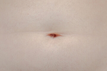 belly button on a man's stomach