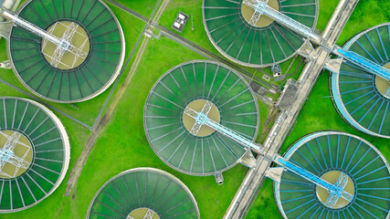aerial view sewage treatment plant near downtown  - obrazy, fototapety, plakaty