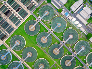 aerial view sewage treatment plant near downtown  - obrazy, fototapety, plakaty