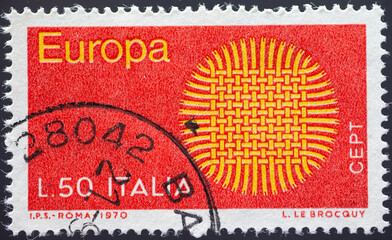 ITALY - CIRCA 1970: a postage stamp from ITALY , showing a round interwoven wickerwork in the shape of a sun. Text: Europe, CEPT. Circa 1970