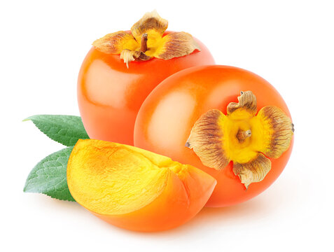 Cut kaki (persimmon) fruits isolated on white background