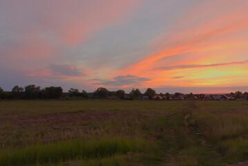 Colorful sunset in summer in the countryside