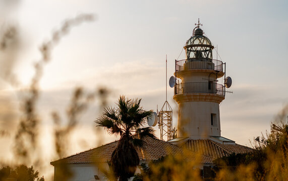 Cullera's lighthouse at dawn, on a clear and sunny day
