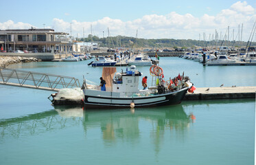 Fototapeta na wymiar Inshore fishing boat in the fishing port of Rota, Cadiz coast, Andalusia Spain