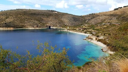 Fototapeta premium Crystal clear waters with sandy beaches and secluded bays.Along the Ionian coast is the most beautiful sea where the rugged coast offers magnificent bays with sandy or pebble beaches with a blue-green