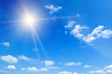 Fototapeta na wymiar blue sky with white clouds and sun