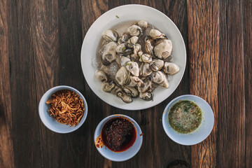 Thai seafood Fresh Oyster with three sauces served on ice.