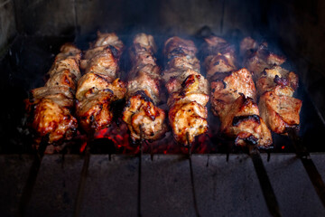 Cooking shish kebab on skewers. Meat on coals.beef, chicken, pork.The concept of street food. Grill. Barbecue