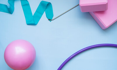 Various gymnastic equipment on a light blue background