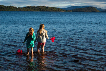 Children having fun playing on Loch Lomond Beech 