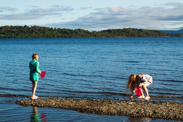 Children having fun playing on Loch Lomond Beech 