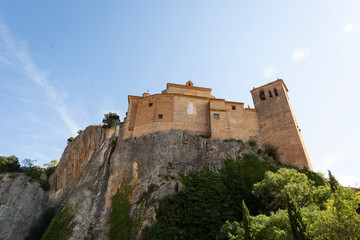 Fototapeta premium view from the bottom up of the Collegiate church of Santa Maria la Mayor in Alquézar (Alquezra), Somontano de Barbastro, province of Huesca, Aragon, Spain