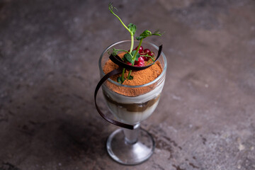 dessert tiramisu in a glass. serving dessert in a restaurant