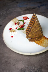 honey cake on a white plate serving dessert in a restaurant
