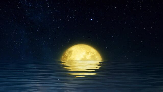 The full moon rises from the ripples in the water