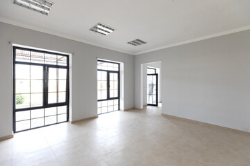 Unfinished building interior, white room.Repairs in the apartment. Preparing in the room.