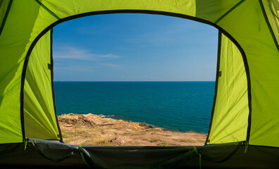 Traveler green tent Being located on the beach look the Blue sea and sky calm landscape viewpoint...