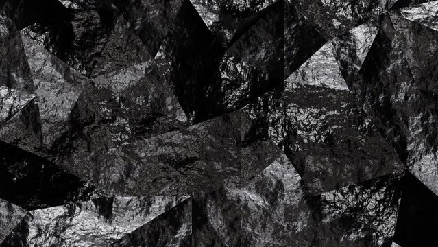 Realistic abstract looping 3D animation of the moving black anthracite coal polygonal surface rendered in UHD as motion background