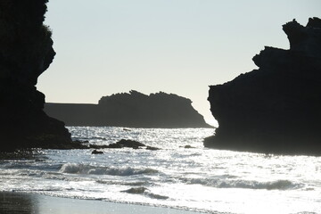 A view of some silhouette rocks during the sunset. The 8th July 2022, Biarritz, France.