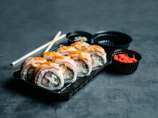 Sushi with chopsticks, ginger, wasabi and soy sauce. Selective focus