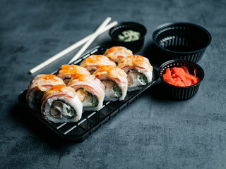 Sushi with chopsticks, ginger, wasabi and soy sauce. Selective focus