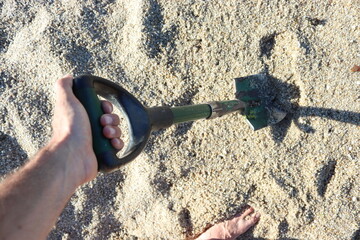 detection shovel at the beach
