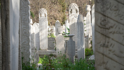 Istanbul, Turkey - April, 2022: Traditional Ottoman style historic old tombstones in the Eyup...