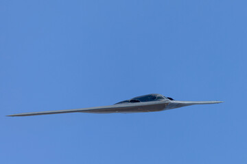Unusual frontal view of a B-2 Spirit  stealth bomber in beautiful light 