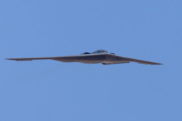 Unusual frontal view of a B-2 Spirit  stealth bomber in beautiful light 