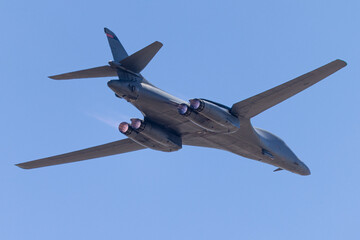 Close tail view of a B-1 Lancer bomber  with afterburners on