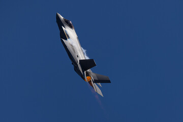 Very unusual close view of a F-35A Lightning II  in a high G maneuver , with condensation clouds...