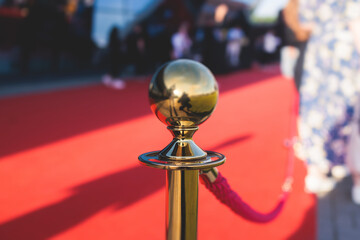 Red carpet with ropes and golden barriers on a luxury party entrance, cinema premiere film festival...