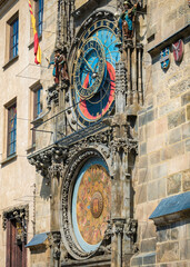 Obraz premium Close up detail with Prague Astronomical Clock Medieval timepiece on the facade of city hall and a famous touristic attraction.