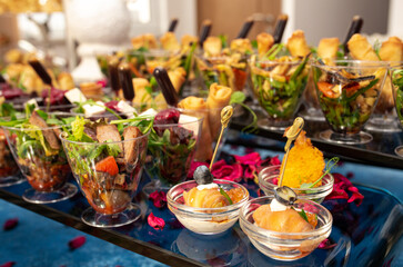 snacks and salads on the buffet table. catering at the event.