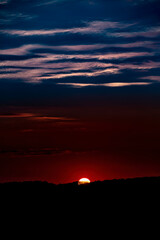 Beautiful sunset background with cloudy sky.