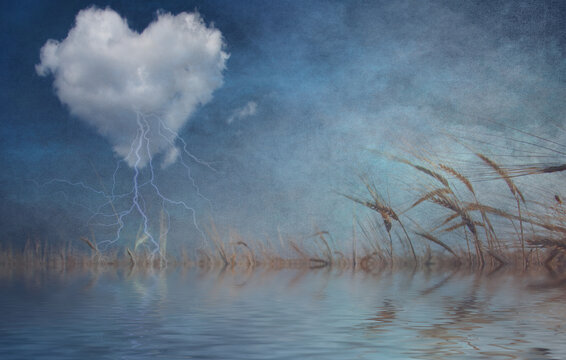 Storm cloud in shape of heart over quiet pond