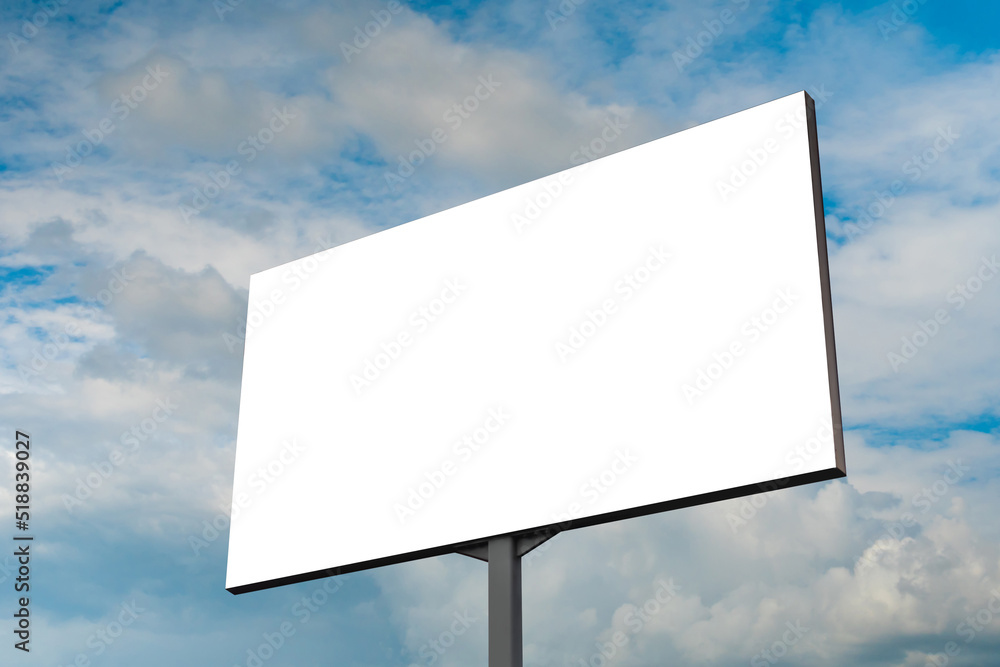 Wall mural mock up - blank white billboard or large advertising display against blue sky with white clouds. con