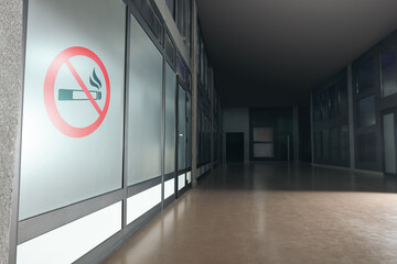 Sign No Smoking drawn on glass wall in office corridor