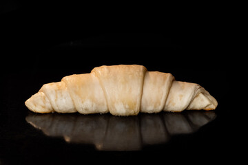 Croissant baking and rising on tray in electric oven - close up view. French cuisine, homemade bakery, breakfast, food, cooking and pastry concept