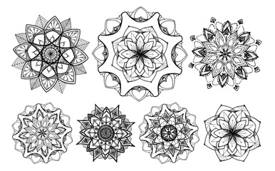 A set of mandalas. a set of hand-drawn round symmetrical ornaments, black isolated contour. The mandala is made in a floral style, stylized as a symmetrical pattern of petals with a black line on whit