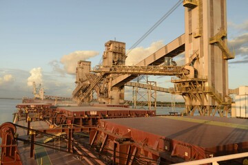 grain loader loading grain in a ship