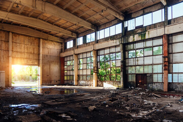 Old broken empty abandoned industrial building waiting for demolition or reconstruction