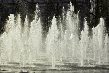 Fountains in Manchester Piccadilly Gardens on a bright sunny day