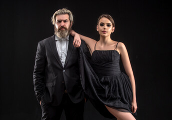 Elegant couple love. Man in a black suit. Luxurious couple. Passionate love concept.