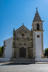Fototapeta na wymiar Goleia in Portugal, the ancient church Notre-Dame-de-la-Conception in the village, the main entry 