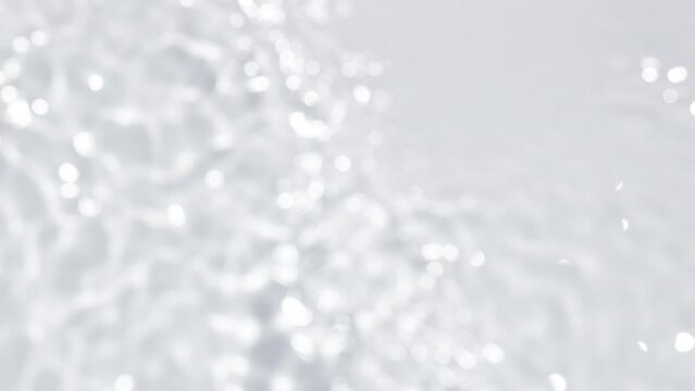 Close up view on Water texture with waves on the water overlay effect for video mockup. Organic light gray drop shadow caustic effect with wave refraction of light. Slow motion full HD video banner.