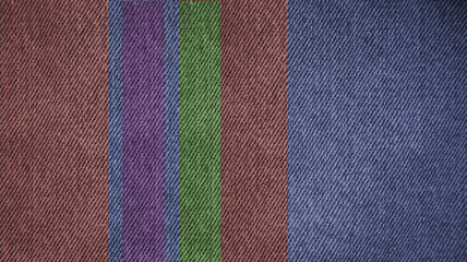 Various colors on denim structure as background       